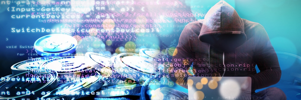 tech design of a hooded hacker looking down at a laptop