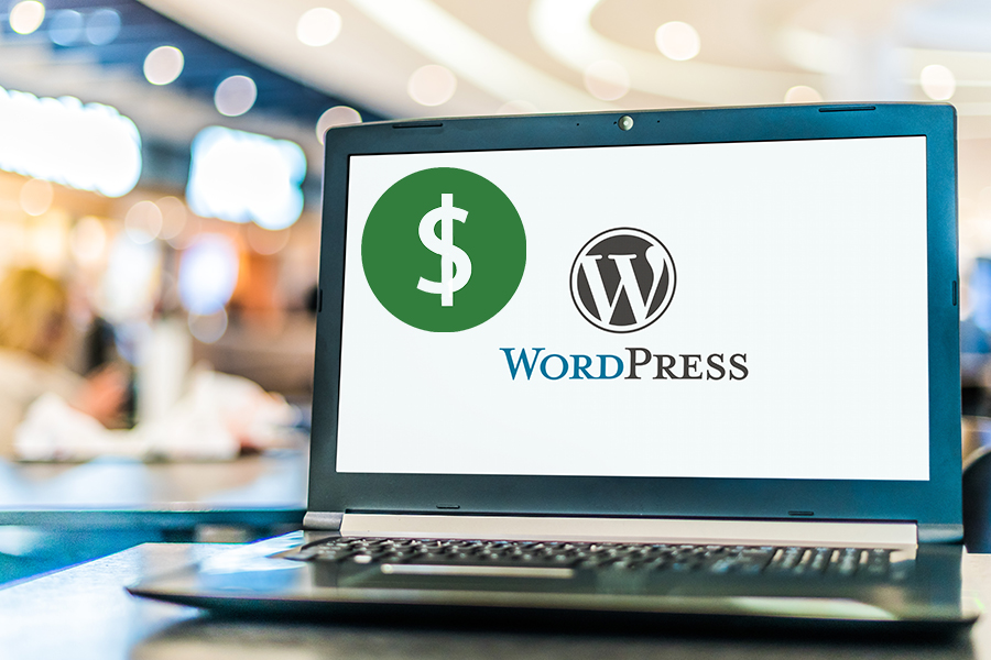 Laptop displaying logo of WordPress and dollar sign, concept on how to make money with WordPress