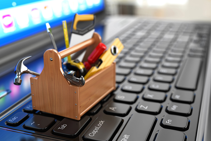 toolkit on laptop keyboard symbolizing wordpress child theme development and troubleshooting issues