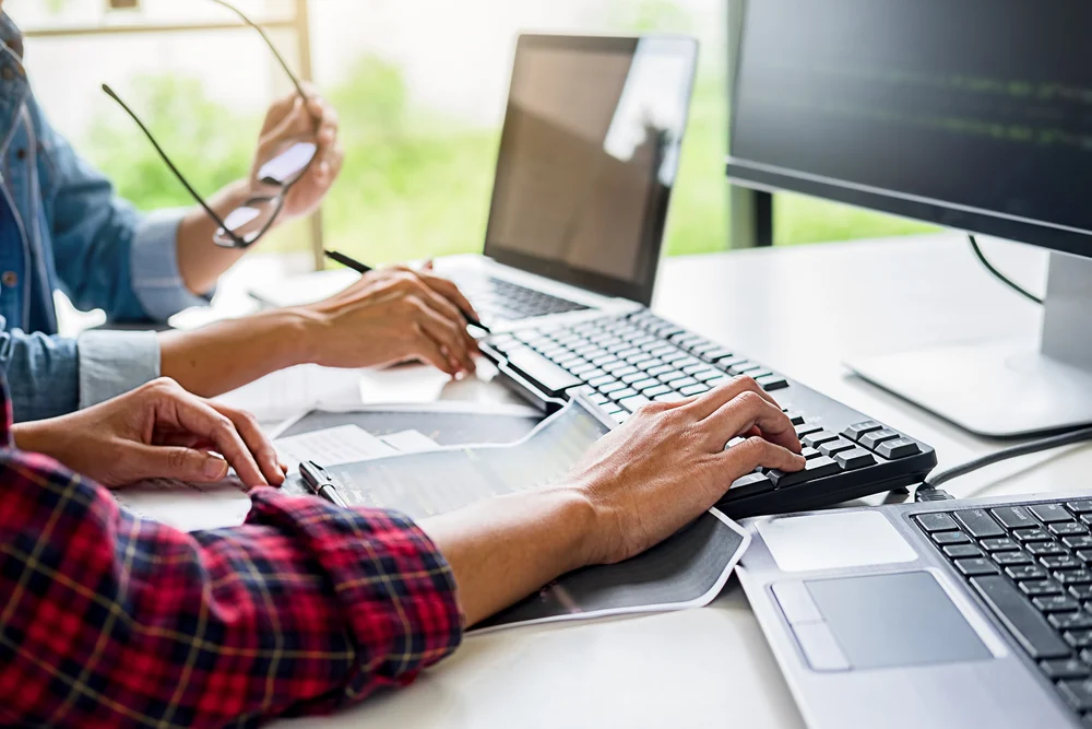 Programmer Working In A Software Development And Coding Technolo concept image for website developers working on wix to wordpress migration