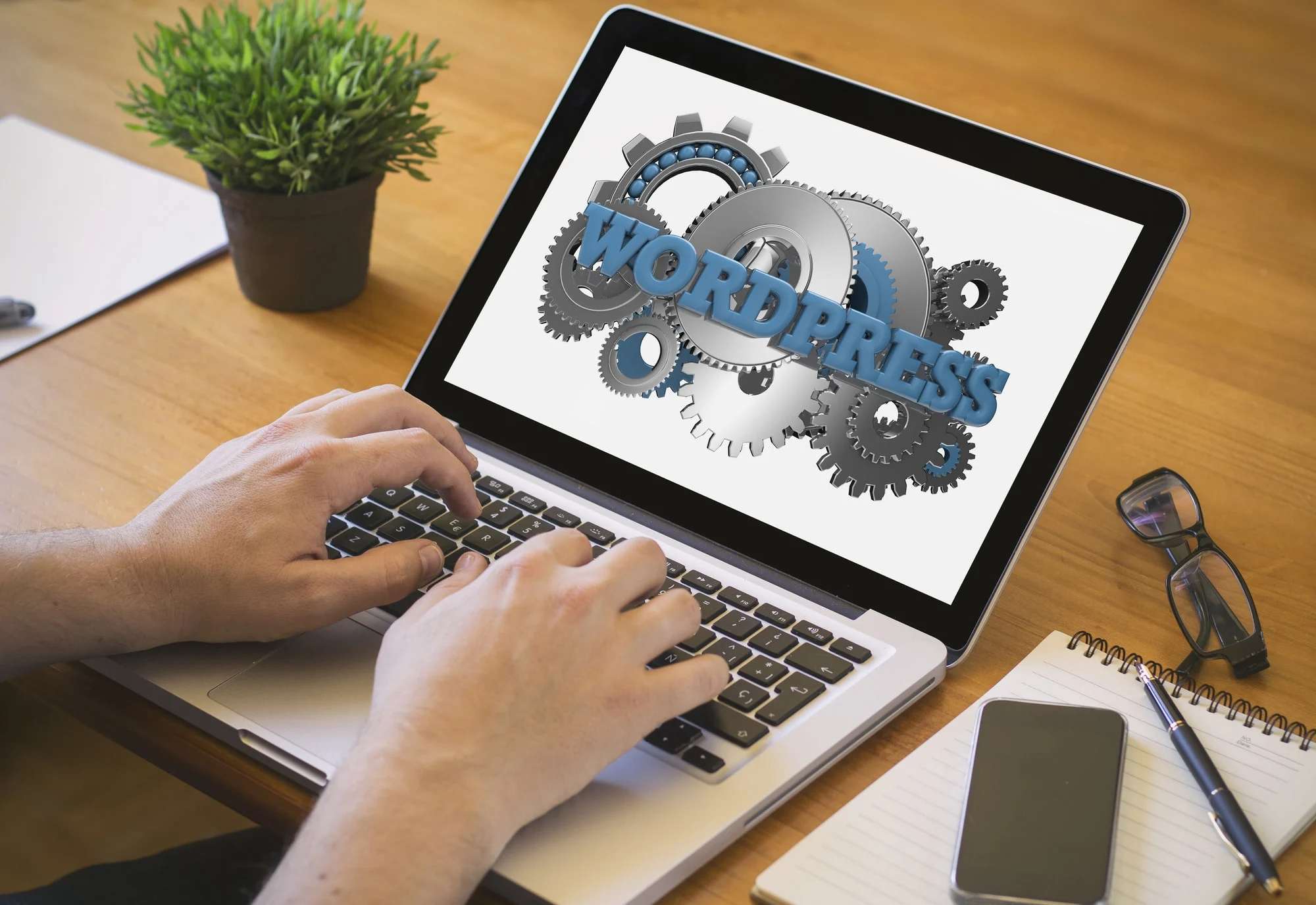 how to use wordpress as a cms featured image - laptop monitor with wp lettering